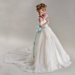 Elegant White and Blue Doll with Floral Accent